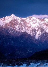 Traveler photo: Amid clouds over Nyingchi, Tibet, Mount Namcha Barwa stands like a silver pyramid, guarding the Yarlung Tsangpo Grand Canyon. (February 2026)