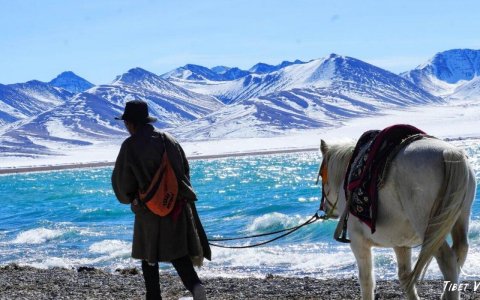 Traveler photo: On snowy mornings after snowfall at holy Namtso Lake in Tibet, a local herder with ribbon-decorated horse becomes vivid scenery by blue ice lake. (January 2026)
