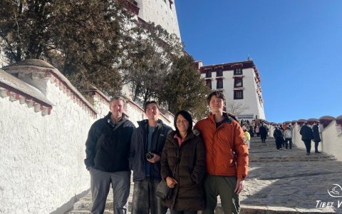 Traveler photo: By white-walled pathways of Potala Palace in Lhasa, a happy family documents precious family travel moments against snowy sanctuary backdrop. (January 2026)