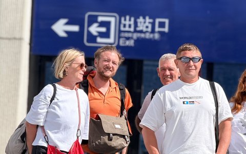 Traveler photo: A candid shot of a guest exiting Lhasa Station, with sunlight falling naturally on their face. (July 2026)