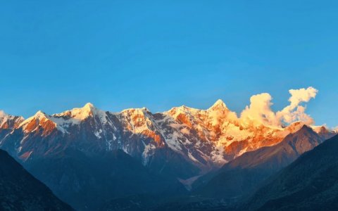 Traveler photo: Bathed in sunset light, Mount Namcha Barwa glows gold, its sharp outline both clear and imposing. (July 2026)