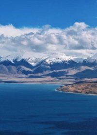 Traveler photo: In July, clear skies reveal stunning views of Namtso Lake backed by Nyenchenn Tanggula Mountain. (July 2025)