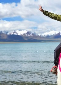 Traveler photo: With the sacred lake in turquoise blue and a friendly yak beneath, the guest enjoys a fun and memorable ride. (June 2026)