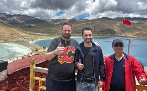 Traveler photo: The Yamdrok viewpoint offers a perfect backdrop of turquoise waters where guests freeze joyful moments together. (June 2026)