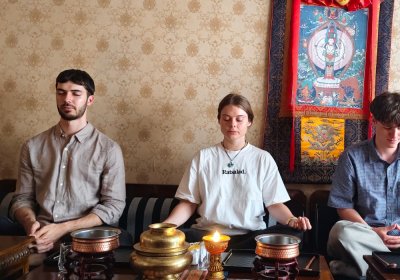 Traveler photo: Three guests sit in meditation at our studio, eyes closed, quietly feeling inner peace and focus. (June 2026)