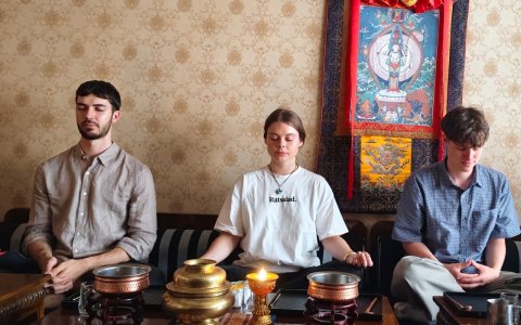 Traveler photo: Three guests sit in meditation at our studio, eyes closed, quietly feeling inner peace and focus. (June 2026)