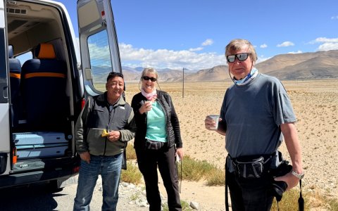 Traveler photo: A quick break on the road: parking, sipping hot tea, gazing at snow peaks, and planning the way ahead. (June 2026)