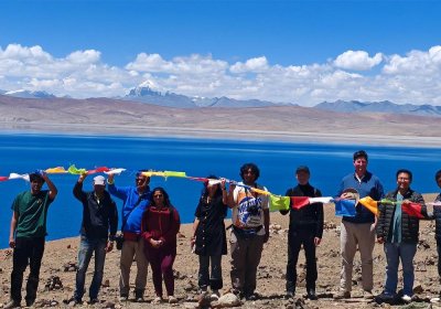 Traveler photo: Holding prayer flags by sacred Lake Manasarovar, sending wishes with the wind. (Jun 2025)