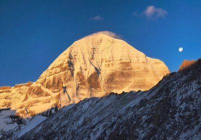 Traveler photo: Sunset casts a golden glow over the summit of Mount Kailash, the holiest mountain in Tibet. (June 2026)	