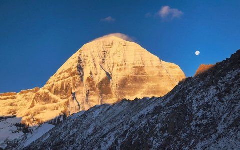 Traveler photo: Sunset casts a golden glow over the summit of Mount Kailash, the holiest mountain in Tibet. (June 2026)	