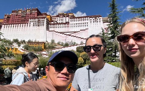 Traveler photo: In front of the Potala Palace in Lhasa, our guide and guests snap a joyful selfie. (Jun 2025)