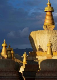 Traveler photo: As the sun sets over Ngari, the ancient stupas stand in quiet majesty against the golden horizon. (June 2026)	