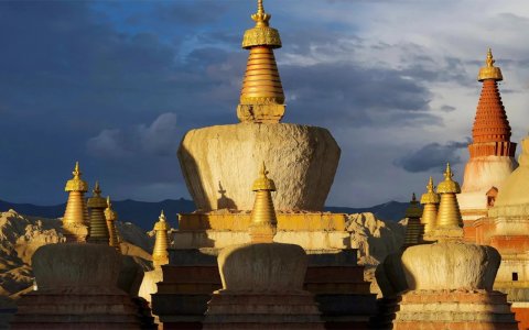 Traveler photo: As the sun sets over Ngari, the ancient stupas stand in quiet majesty against the golden horizon. (June 2026)	