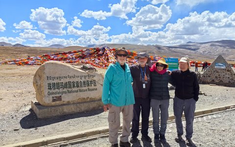 Traveler photo: Colorful Tibetan prayer flags flutter in the mountain wind, carrying prayers of peace, compassion, and good fortune across the plateau. (June 2026)	