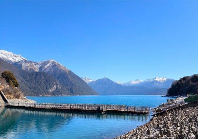 Traveler photo: In March, Basum Lake in Nyingchi rests like a turquoise jewel embraced by snow mountains, serene and sacred. (March 2026)