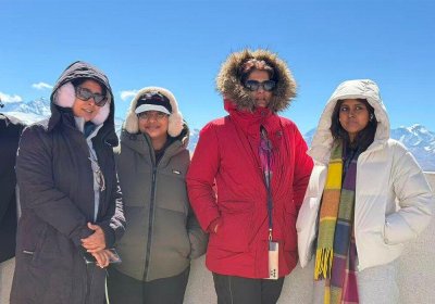 Traveler photo: On Gawula Pass viewing platform in Tibet, endless snow mountains behind our guests witness this unforgettable journey. (March 2026)