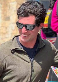 Traveler photo: A guest crouches among children, laughing together—the lens captures an innocent friendship that transcends all language. (March 2026)