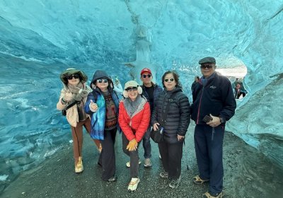 Traveler photo: Our beloved guests take photos inside the stunning blue ice cave of Laigu Glacier, one of the most beautiful glaciers in Tibet. (May 2025)	