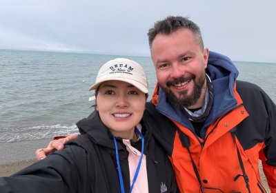 Traveler photo: The guest and guide smile toward the camera—one dedicated to service, the other to the joy of travel. (May 2026)