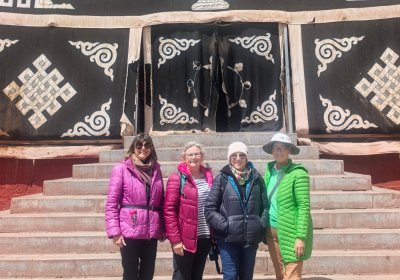 Traveler photo: Smiling toward the camera at the temple entrance, our guests let the sacred architecture speak of faith. (May 2026)