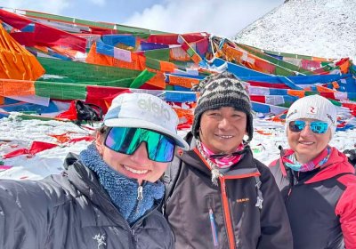 Traveler photo: During the Mount Kailash pilgrimage, guests and their guide pause for an energetic group photo along the sacred path. (May 2026)