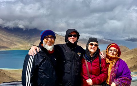 Traveler photo: Group photo along the shore of Yamdrok lake, one of the three holy lakes in Tibet and just 2 hours drive from Lhasa. (May 2026)	
