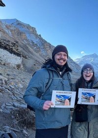 Traveler photo: At Mount Everest Base Camp in Tibet, our guests hold summit certificates while photographing with the world's highest peak. (November 2025)