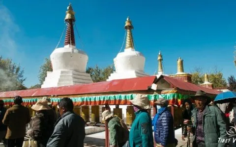 Traveler photo: The local pilgrims kora inside the Tibetan monastery with rolling the big praying wheels. (November 2025)