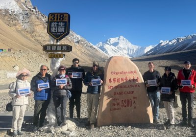 Traveler photo: Group photo with Mount Everest at Everest Base Camp in Tibet. (October 2026)