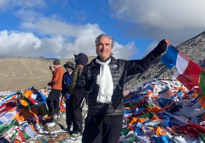 Traveler photo: Hanging Tibetan prayer flags during a Tibet tour is another memorable experience. (October 2026)