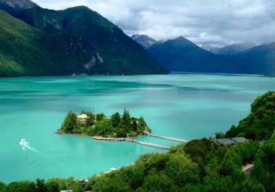 Traveler photo: The blue waters of Basum Tso Lake surrounded by lush forests in Nyingchi. (September 2026)