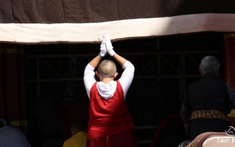 Traveler photo: Local pilgrims praying in front of a Tibetan monastery. (September 2025)	