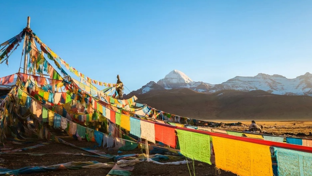 Colorful prayer flags hanging before Mount Kailash