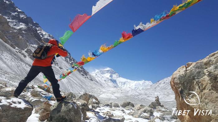 Use fluttering Tibetan prayer flags as a foreground to add depth to your Mt. Everest photos