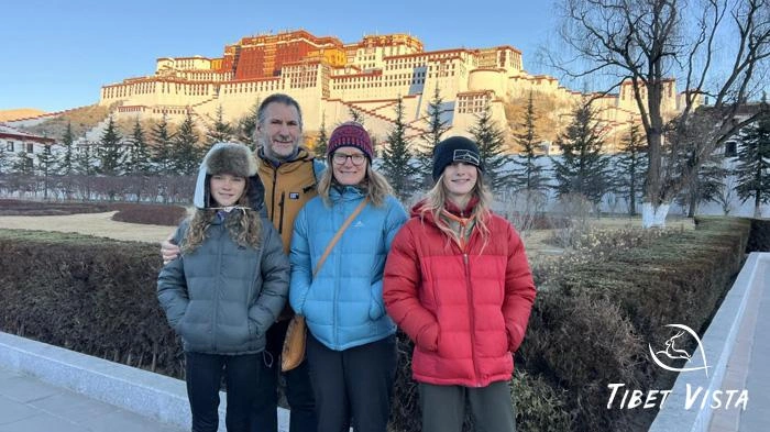 A family visit Potala Palace in winter