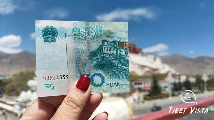 Take a photo of the Potala Palace and a 50 RMB banknote together