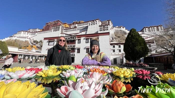 Tourists taking photos in front of the Potala Palace