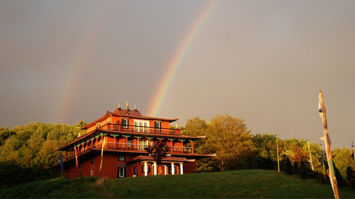 The rainbow over tibetan monastery