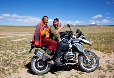 Ride the motor cycle to visit Ganden Monastery