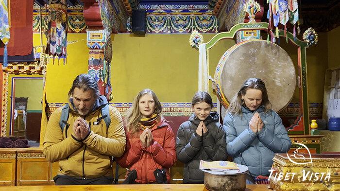Family from New Zealand meditate in Rongbuk Monastery