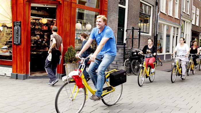 A Cyclist Enjoys Biking on Kathmandu street