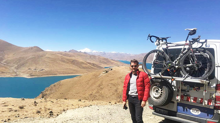 A cycle enthusiast reaches the Lake Yamdrok Tso.