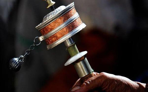 Tibetan Buddhists' life with prayer wheel