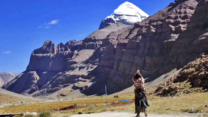 pilgrims prostrate along the sacred Mount Kailash kora