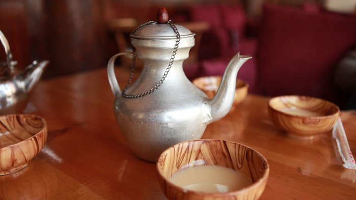 Wooden bowl and butter tea