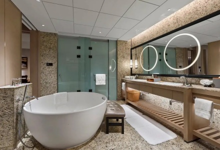 Luxury private bathroom with a freestanding bathtub and double vanities