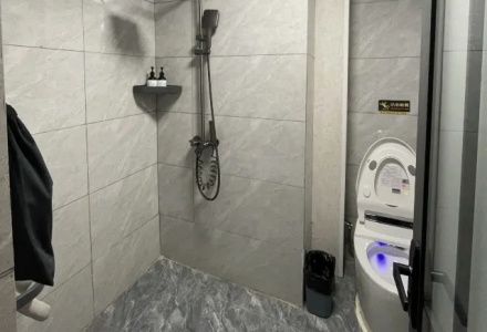Modern private bathroom with shower and smart toilet at Shenling Mountain Hotel