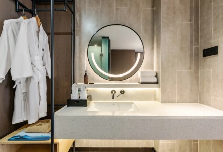 Bathroom vanity with round lighted mirror