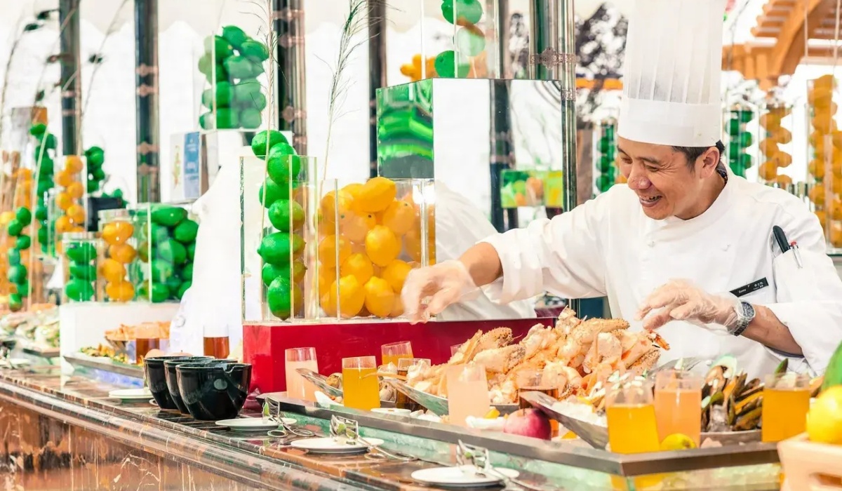 Chef preparing buffet dishes at InterContinental Lhasa Paradise restaurant
