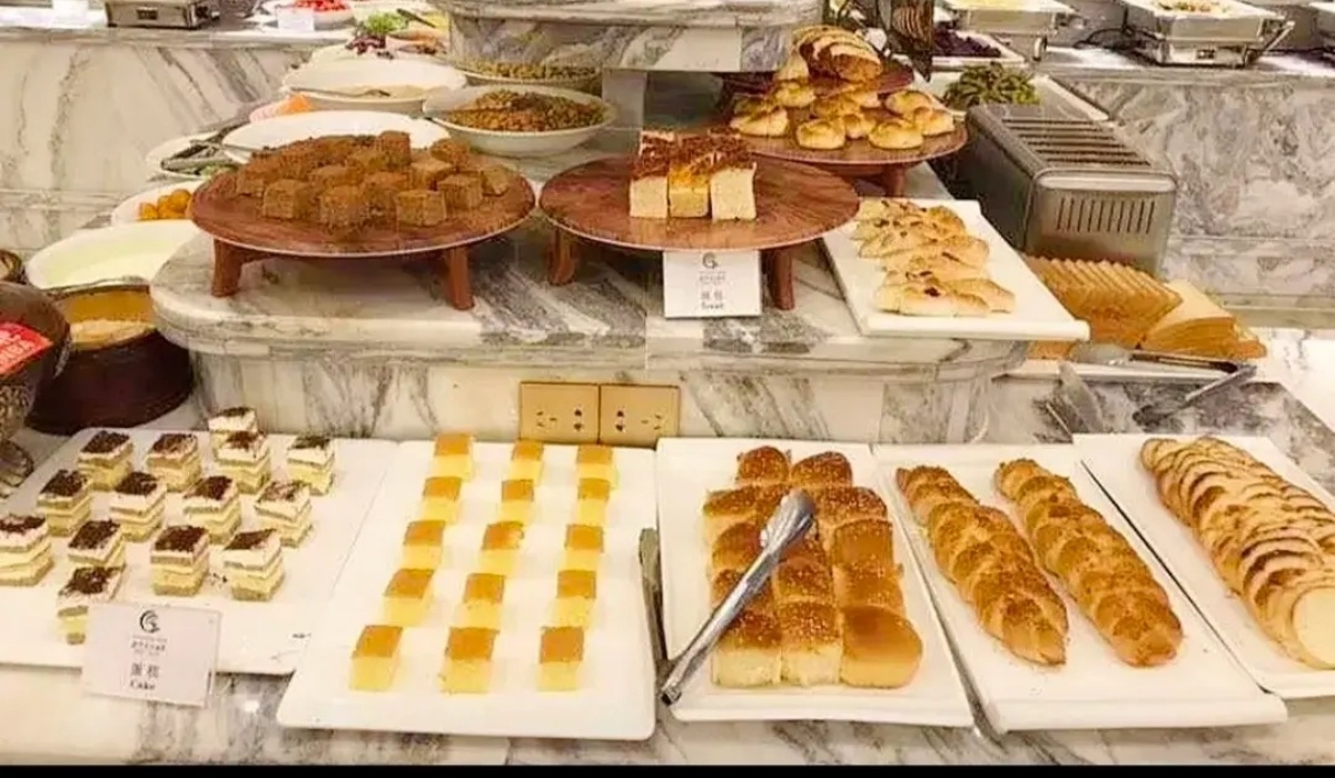Hotel restaurant buffet display with fresh pastries and bread